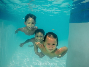 Three kids swimming by Jan Morton 
